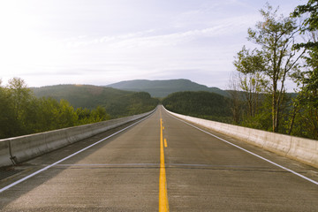 Beautiful eampty road with mountain and forest view in the spring time. Landscape of state Washington, USA