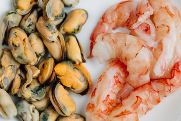 Mussels and prawns on white plate. Healthy Seafood