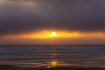 Colorful sunset above sand beach in bayocean peninsula park oregon, USA