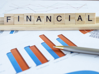 Word spell "Financial" over graph and chart report 1