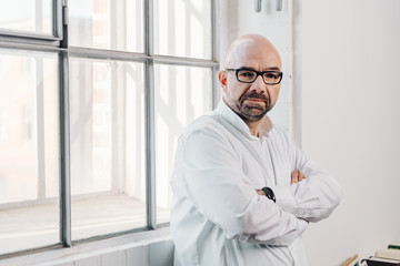 Confident businessman staring intently at camera