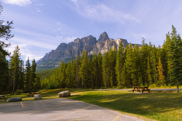 Parking lot with picnic table in beautiful landscape in Rocky Mountains in Canada during sunset - 187617782