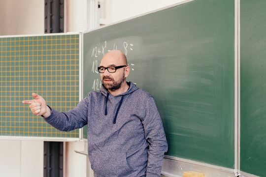 Portrait of dedicated Maths teacher during class