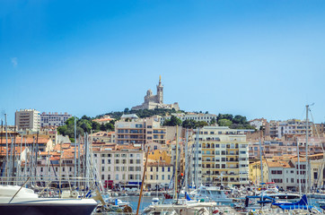 Summer view on basilica of Notre Dame de la Garde and old port in Marseille, France