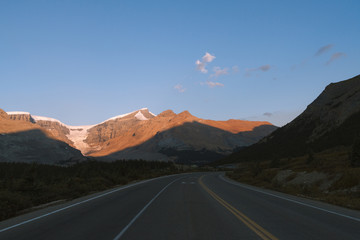 Scenic Icefields Parkway with sunrise light on mountains in Jasper, Canada