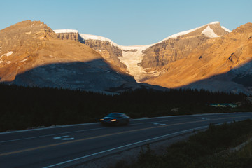 Scenic Icefields Parkway with sunrise light on mountains in Jasper, Canada