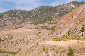 Scenic remote highway in Rocky Mountains, British Columbia, Canada on sunny day