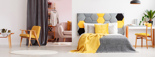 Yellow bright bedroom with wardrobe