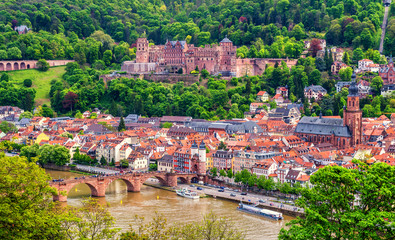 Fototapeta na wymiar Panoramic view of beautiful medieval town Heidelberg including Carl Theodor Old Bridge, Neckar river, Church of the Holy Spirit, Germany