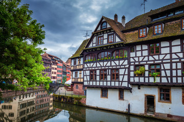 Beautiful view of the historic town of Strasbourg, colorful houses on idyllic river. Strasbourg, France