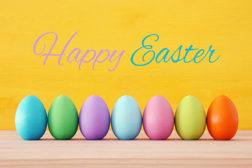 Top view of easter colorful eggs over blue background