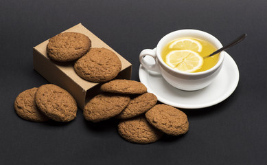 Oatmeal biscuits as pastry for cup of tea with lemon