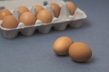 Raw, brown, chicken eggs with a tray.