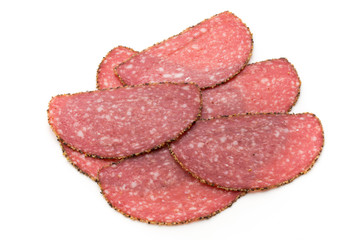 Salami slices isolated on the white background.