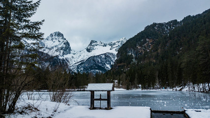 great shot from the famous schiederweiher in austria, little lake in front of huge mountains