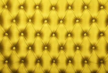 Fototapeta premium Yellow capitone tufted fabric upholstery texture