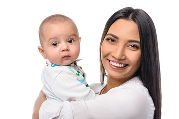 portrait of cheerful mother with infant baby on hands isolated on white