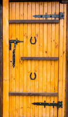 old weathered wooden door with a leather cord