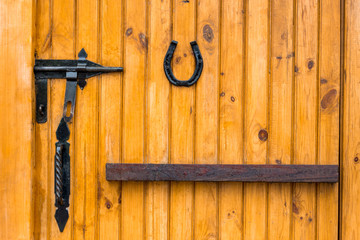 old weathered wooden door with a leather cord