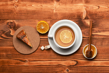 English tea time concept. Cup of green tea with orange
