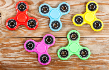 Group of spinners on wooden table