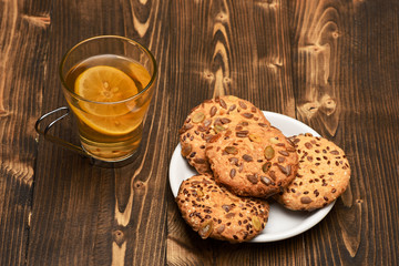 Drink and homemade goods concept. Cookie made of oatmeal