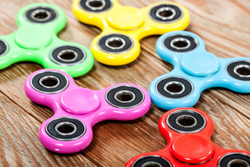 Group of spinners on wooden table