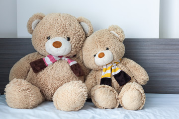 Teddy bear on bed.