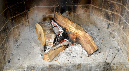 image of a fireplace with wood and ash