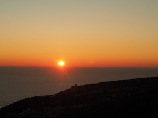 Bright sky and water at sunset over the sea
