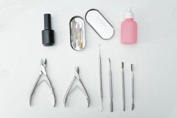 Manicure set. Tools, scissors and care products. White background.