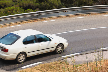 Fototapeta na wymiar old car in a bend on a mountain road