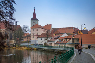 Small town Blatna on embankment of river Lomnice in evening time, Czech Republic