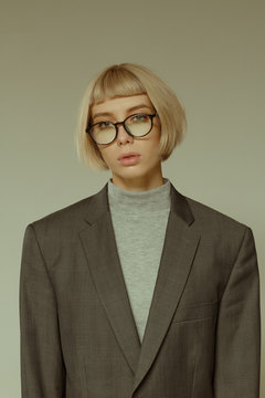 Blonde girl with short hair style in fashion glasses