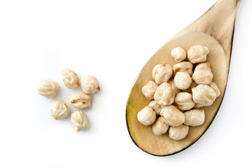 Chickpeas on wooden spoon isolated on white background