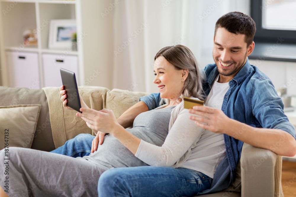 Canvas Prints man and pregnant wife shopping online at home