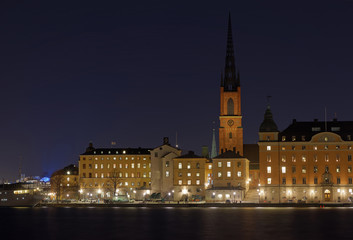 Fototapeta na wymiar The medieval Church Riddarholmskyrkan built 1300, during evening/night in central Stockholm