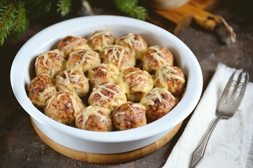 Meat balls with rice and onions baked with cheese. Delicious, hearty, family dinner.