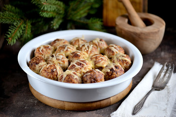 Meat balls with rice and onions baked with cheese. Delicious, hearty, family dinner.