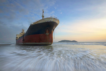 shipwreck or wrecked cargo ship abandoned on Thailand