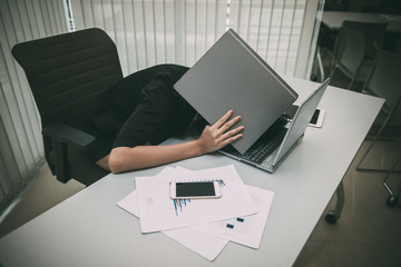 Asian business Tired from work,Worker relax from work on the desk,Thailand people