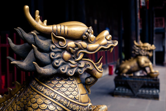 Close up of lion bronze head statue in a temple of China
