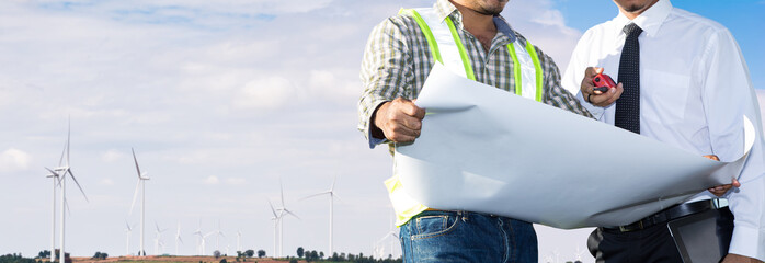 Engineers are investigating the wind turbine.