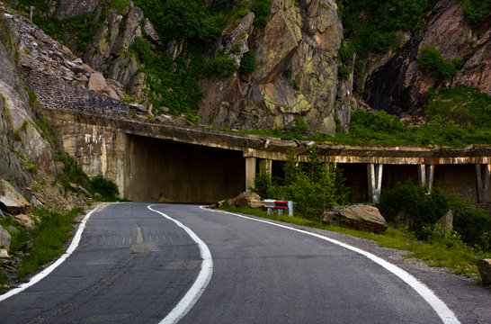 tunnel on Transfagarasan road of Romania. dangerous transportation scenery among the rocky cliffs in high Carpathian mountains in summer morning. 