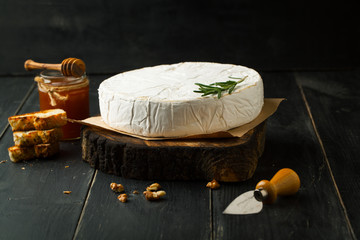 Cheese brie with honey and rosemary