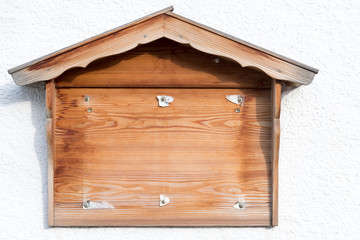 Wooden shield in form of a little cottage