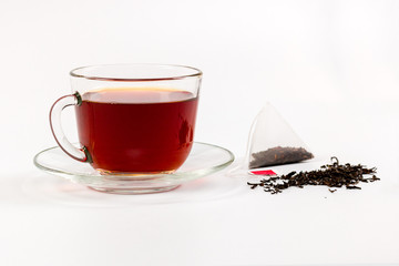 transparent cup of tea isolated on white