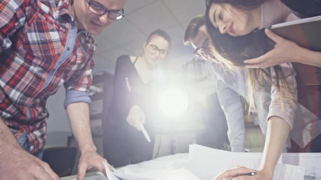 Team of architects working together on building plan in an office