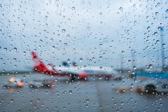 View from the airplane window in rainy non-flying weather rain