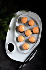 Homemade hot rolls baked with a sauce of two kinds of cheese.